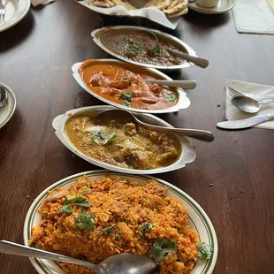 Bottom to Top: Chicken Biryani, Fish Rheshmi, Chicken Tikka Masala, Lamb Curry, and Garlic Naan
