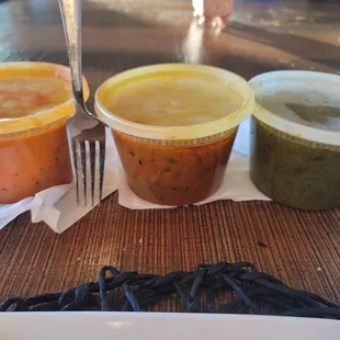 Butter chicken, lamb curry, &amp; saag to go. Everything about $47 total. Here's a fork next to it all for size reference.