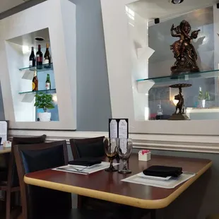 a dining area with tables and chairs