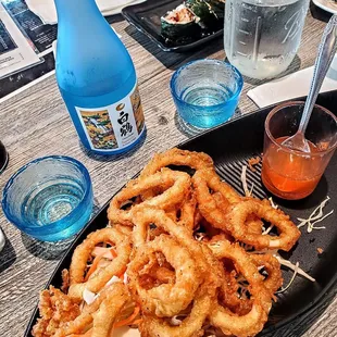 Fried calamari, cut eel roll and cold sake