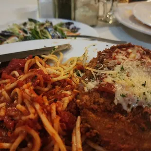 a plate of spaghetti and meat