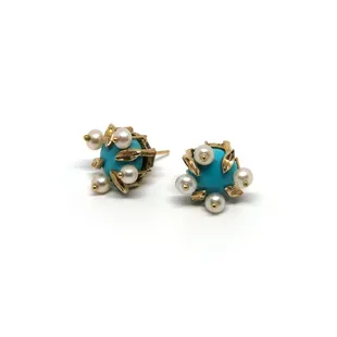 without a blemish; this is as perfect as turquoise gets. Turquoise buttons framed in gold, and  mini pearls
