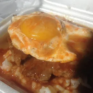 Nanakuli Loco (with me adding hot sauce) - very tasty. Patty is nice and juicy and tender. Not a bad deal for $5