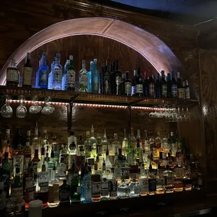 Full bar. Large selection of Absinthe up top.