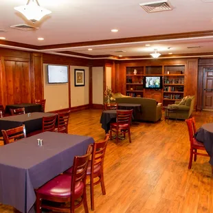 a dining room with tables and chairs