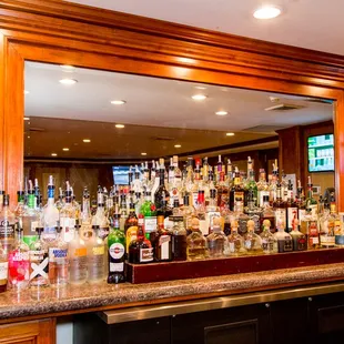 a bar with many bottles of alcohol