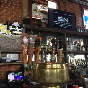 a bar with a large brass pot