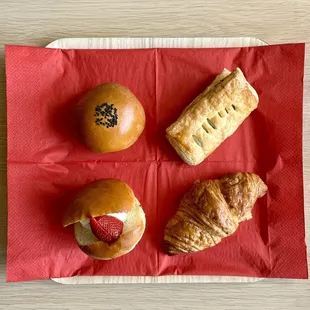 An pan, blueberry cream cheese danish, strawberry red bean cream bread and croissant