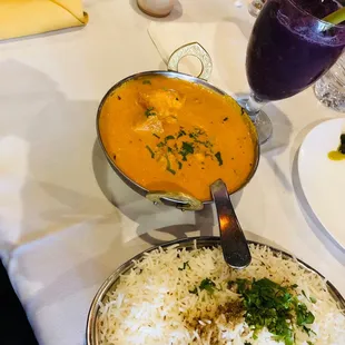 a plate of rice and a bowl of soup