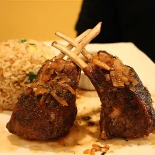 a plate of meat and rice