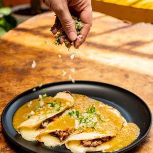 Brisket quesadillas smothered in shishito salsa