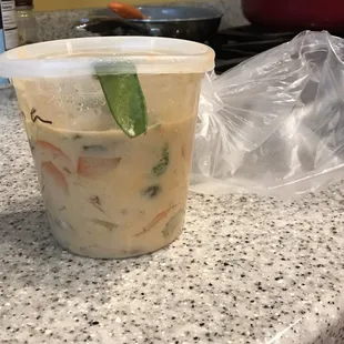 Curry packed haphazardly with a snow pea stuck in the lid which caused a leak on the transport home.