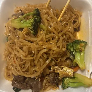 Noodles w/ beef, broccoli, carrots, green onions, eggs, peanuts, and level 1 spice