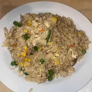 a plate of fried rice and vegetables