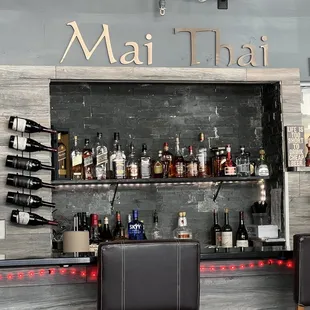 a bar with bottles of alcohol