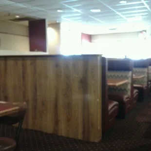 Sitting in a booth and waiting for dinner.