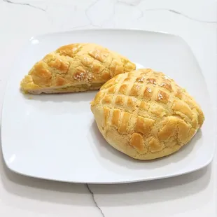 Pineapple buns with custard filling, $2.75 each. They&apos;re a better value and tastier than the cheesecakes.