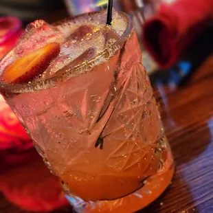a close up of a drink with strawberries