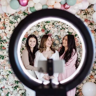 Add a ring light to your floral wall booking.