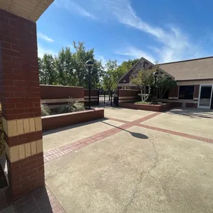 Locked gate to secluded patio area for reception hall