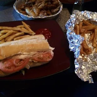 Maietta Hoagie (turkey, bacon, ham, provolone cheese and American cheese) and fries.