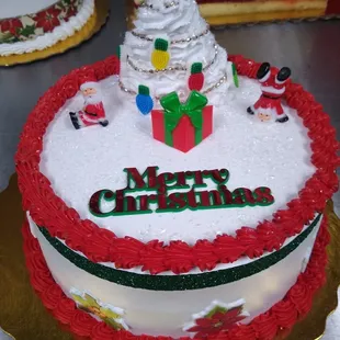 a christmas cake with a santa clause on top