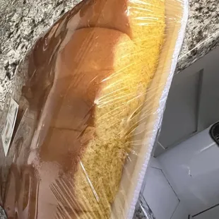 a loaf of bread wrapped in plastic