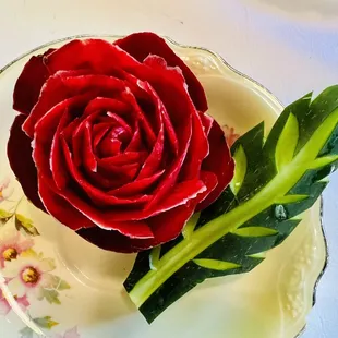 a red rose on a plate