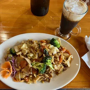 Phad kimaouw with beef (drunken noodles) and Thai ice coffee