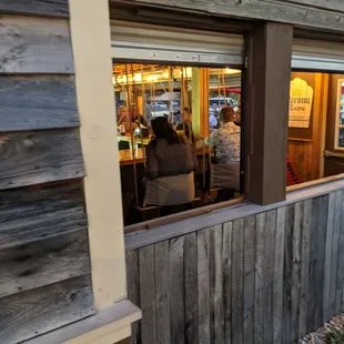 Outside bar and it has swings instead of chairs!