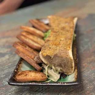 Roasted bone marrow- spread on Toasted baguettes.  Rich and savory