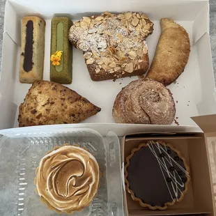 a variety of pastries in a box