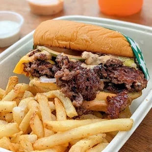The Box  double burger, fries, seasonal lemonade, side of sauce) with an extra side of sauce