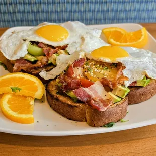 Bacon and Avocado Toast with bagel seasoning and your choice of eggs.