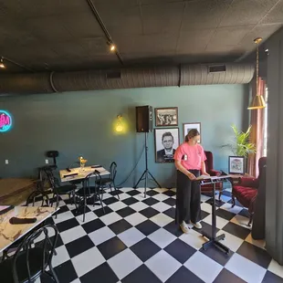 a woman standing in a restaurant