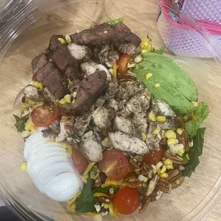 Southwest salad with lamb and jerk chicken added a boiled egg