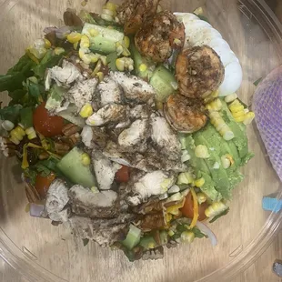 Southwest salad with jerk chicken and jerk shrimp add boiled egg