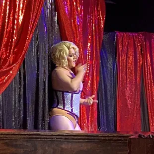 a woman in a corset on stage