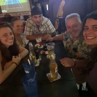 a group of people sitting at a table