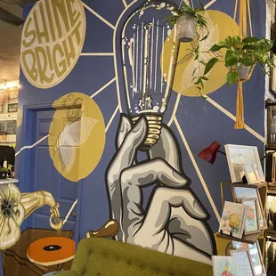 a hand holding a light bulb