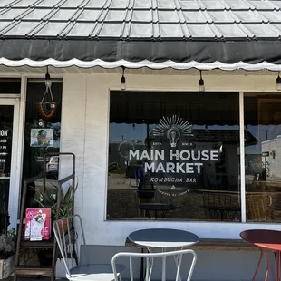 Store front and a few seats outside