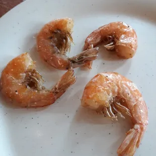 Unpeeled fried Chineese shrimp with all the legs.