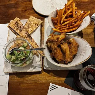 chicken wings, french fries, and salad