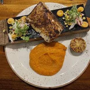 a plate of food on a wooden table