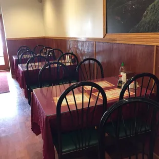 a dining room with tables and chairs