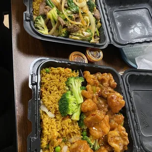 three take out containers of food on a table