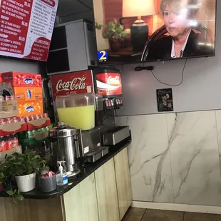 a television mounted on the wall of a restaurant