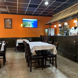 a restaurant with tables and chairs