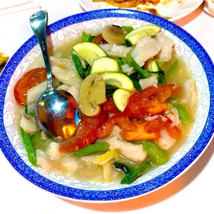 Fish with vegetables in a light white sauce