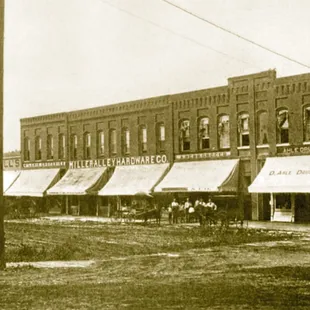 a horse and buggy in front of a building
